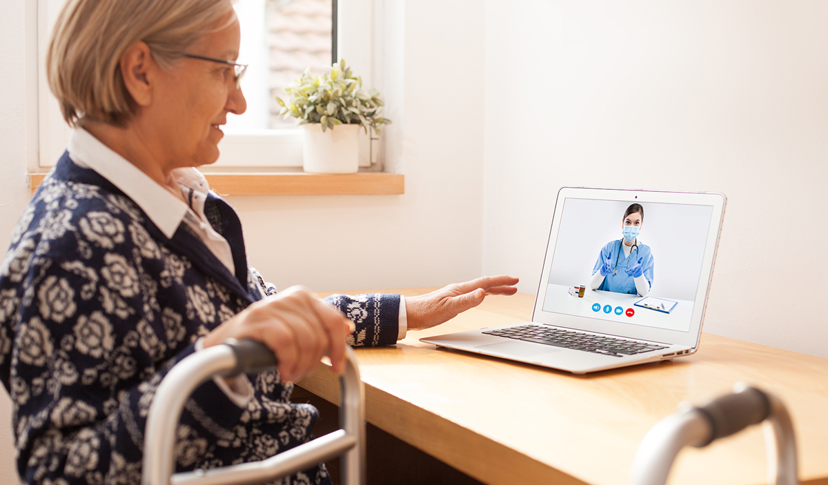 Senior woman talking to her doctor through a video call