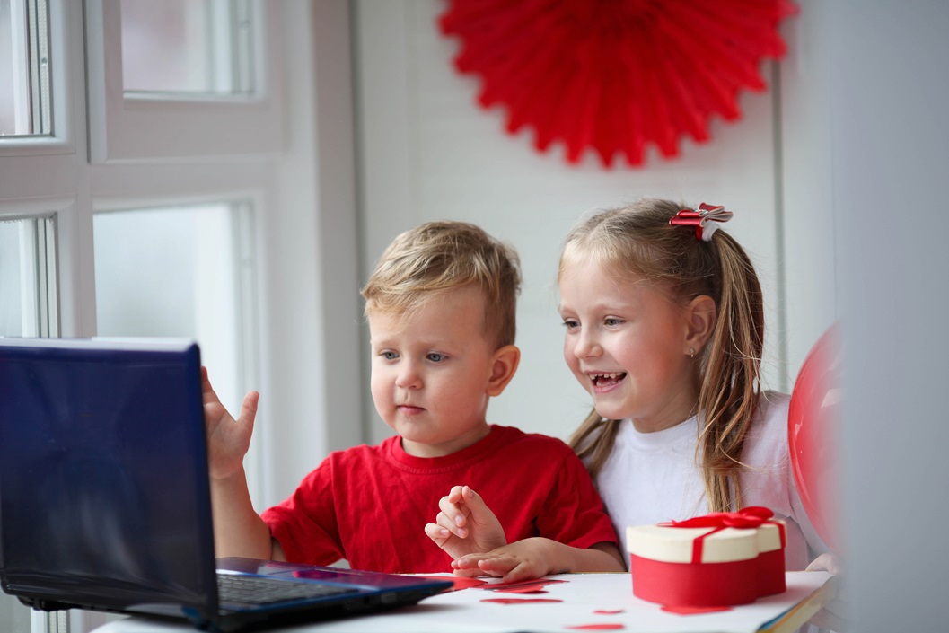 happy kids waving via laptop celebrating february 2023 11 27 05 03 10 utc