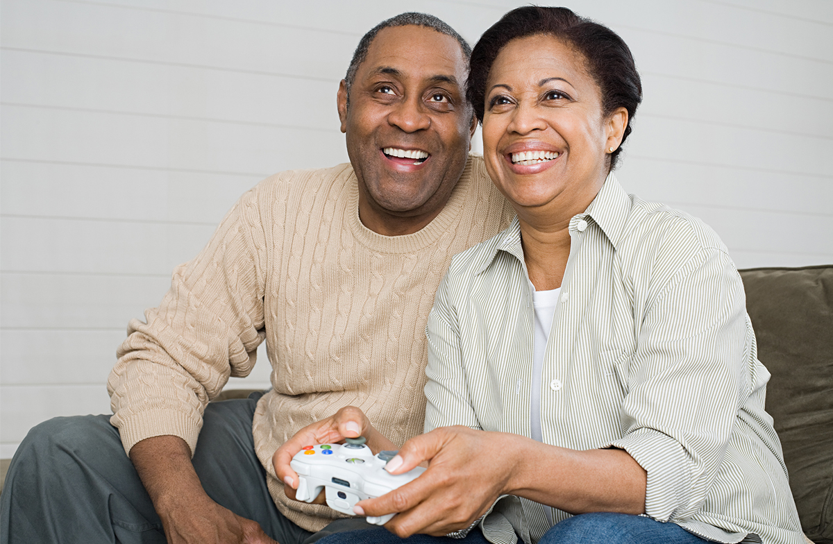 Middle-aged couple playing a video game