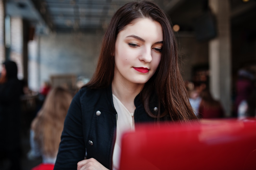 brunette girl sitting on cafe and working with re 2023 11 27 04 49 21 utc