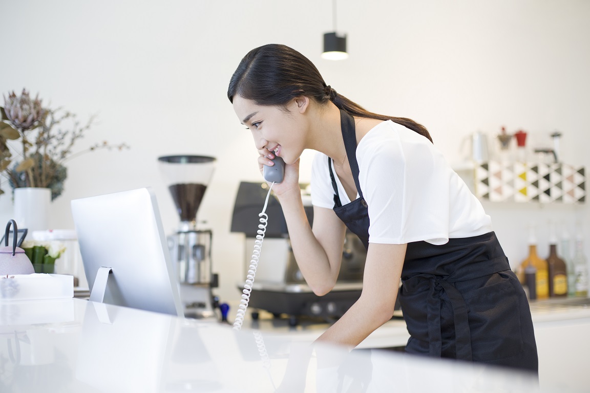 coffee shop owner talking on the phone 2022 04 01 20 25 57 utc