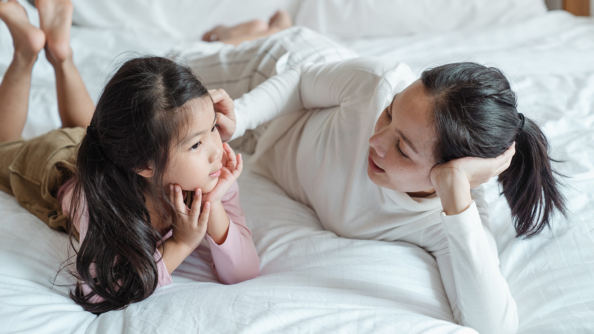 Mother talking kindly to daughter at home