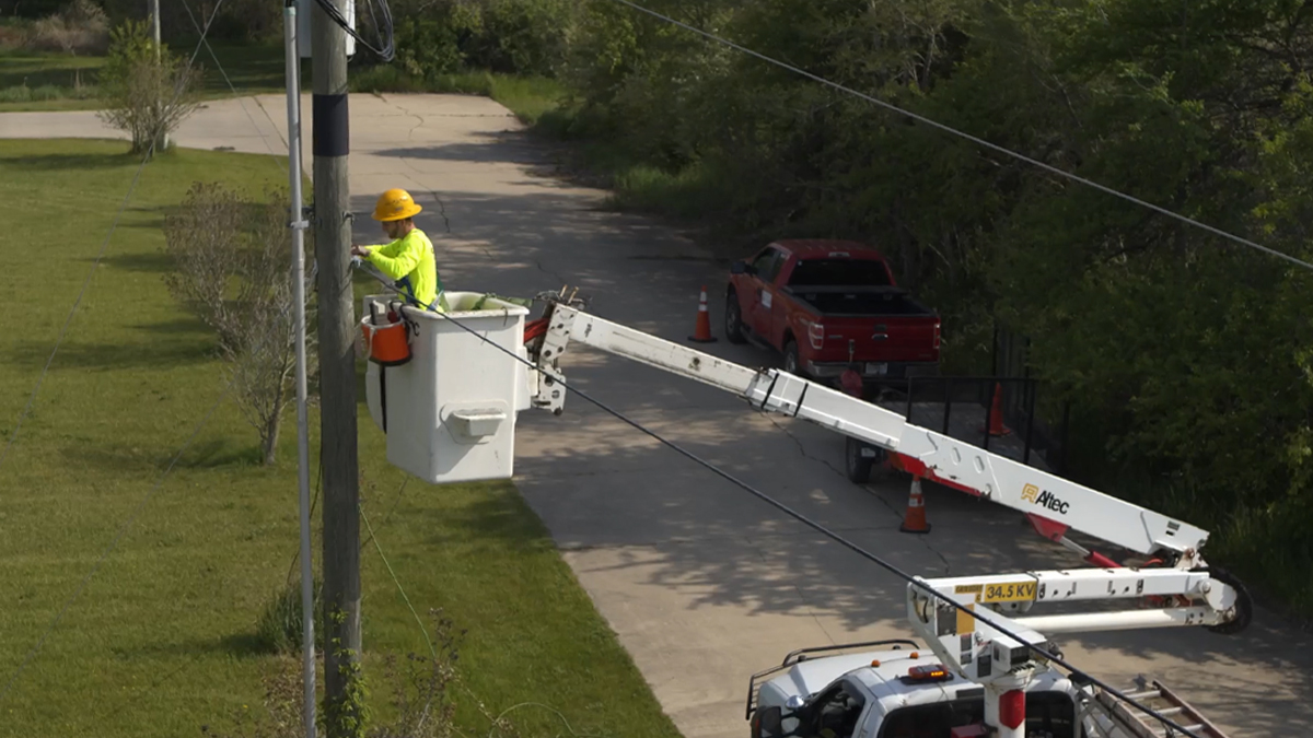 Closer shot of Kosciusko Connect technician working on lines in truck