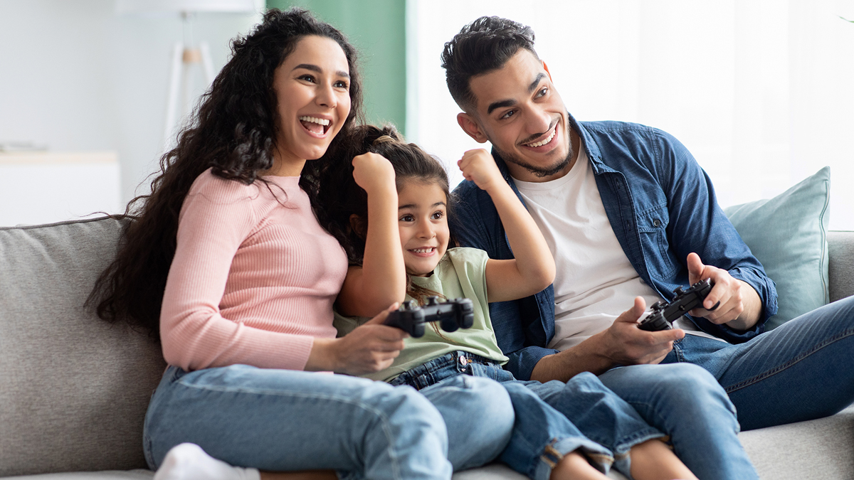 Young family video gaming together