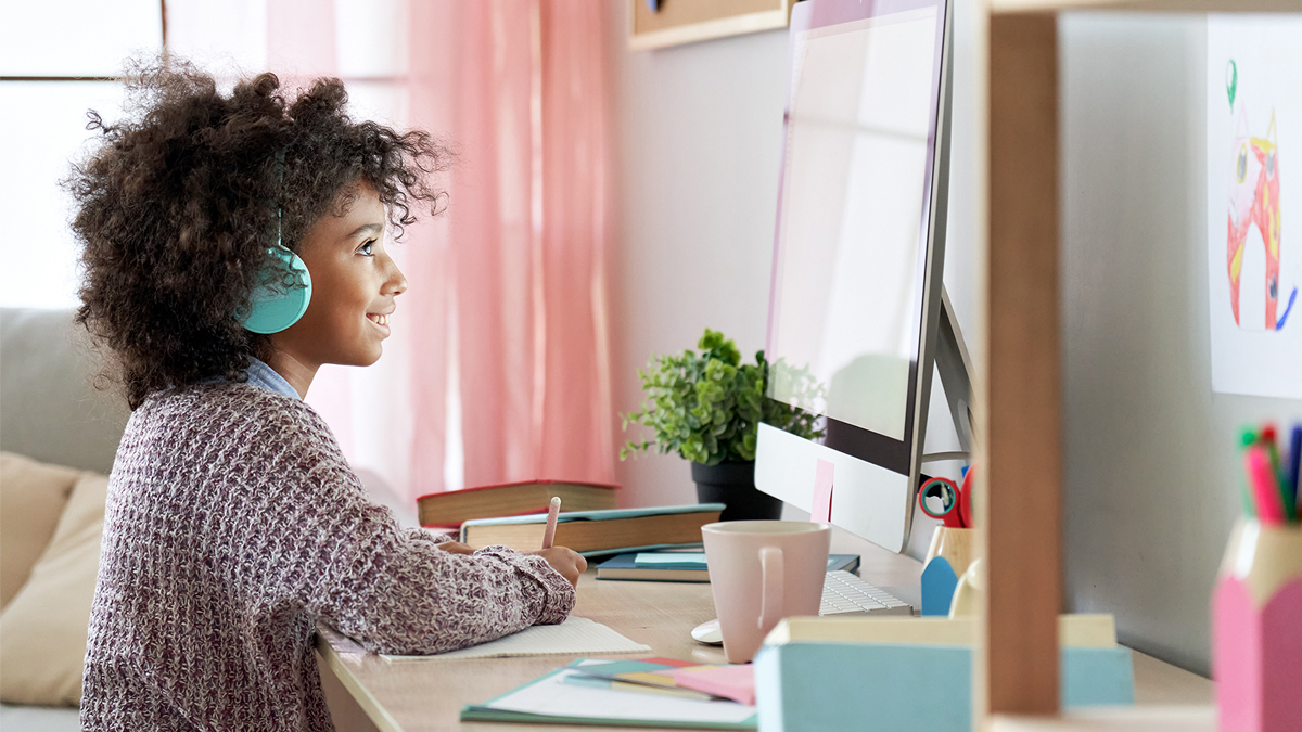 Middle school student learning at home on computer