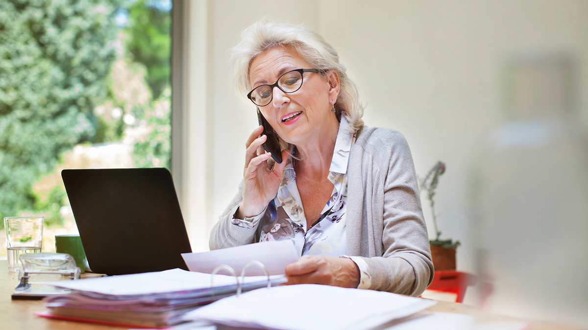 Woman talking on phone about her bill