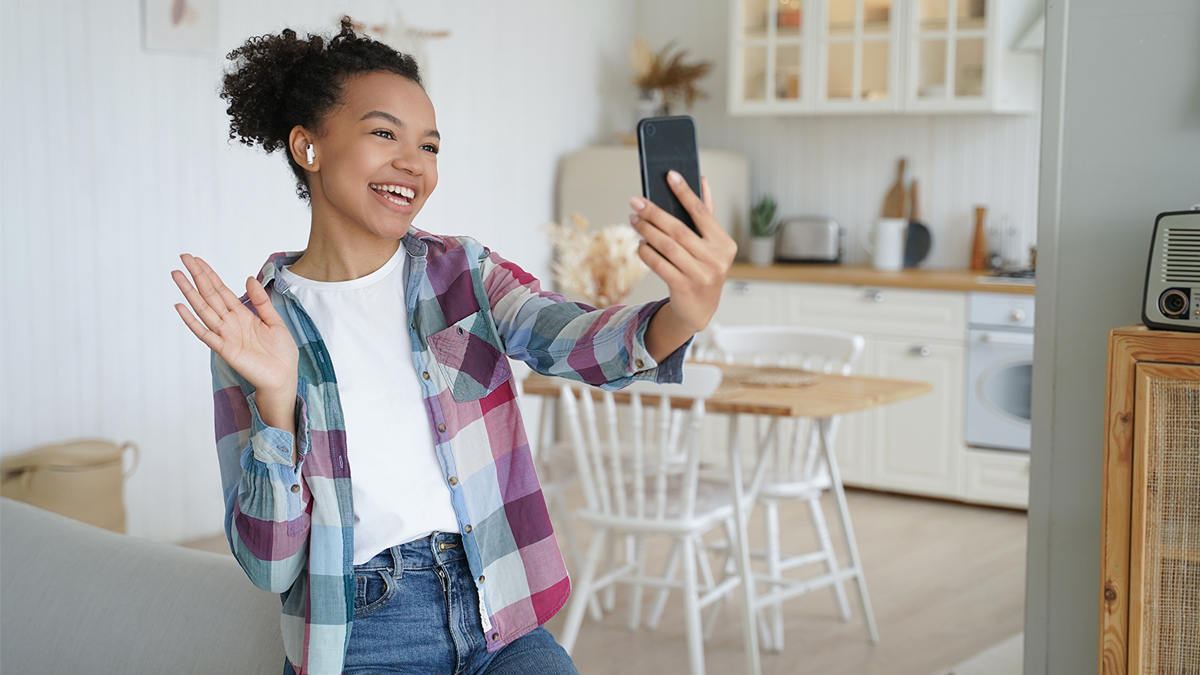 Teenage girl smiling on video call