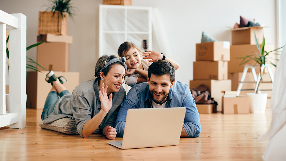 family on video call together in new home