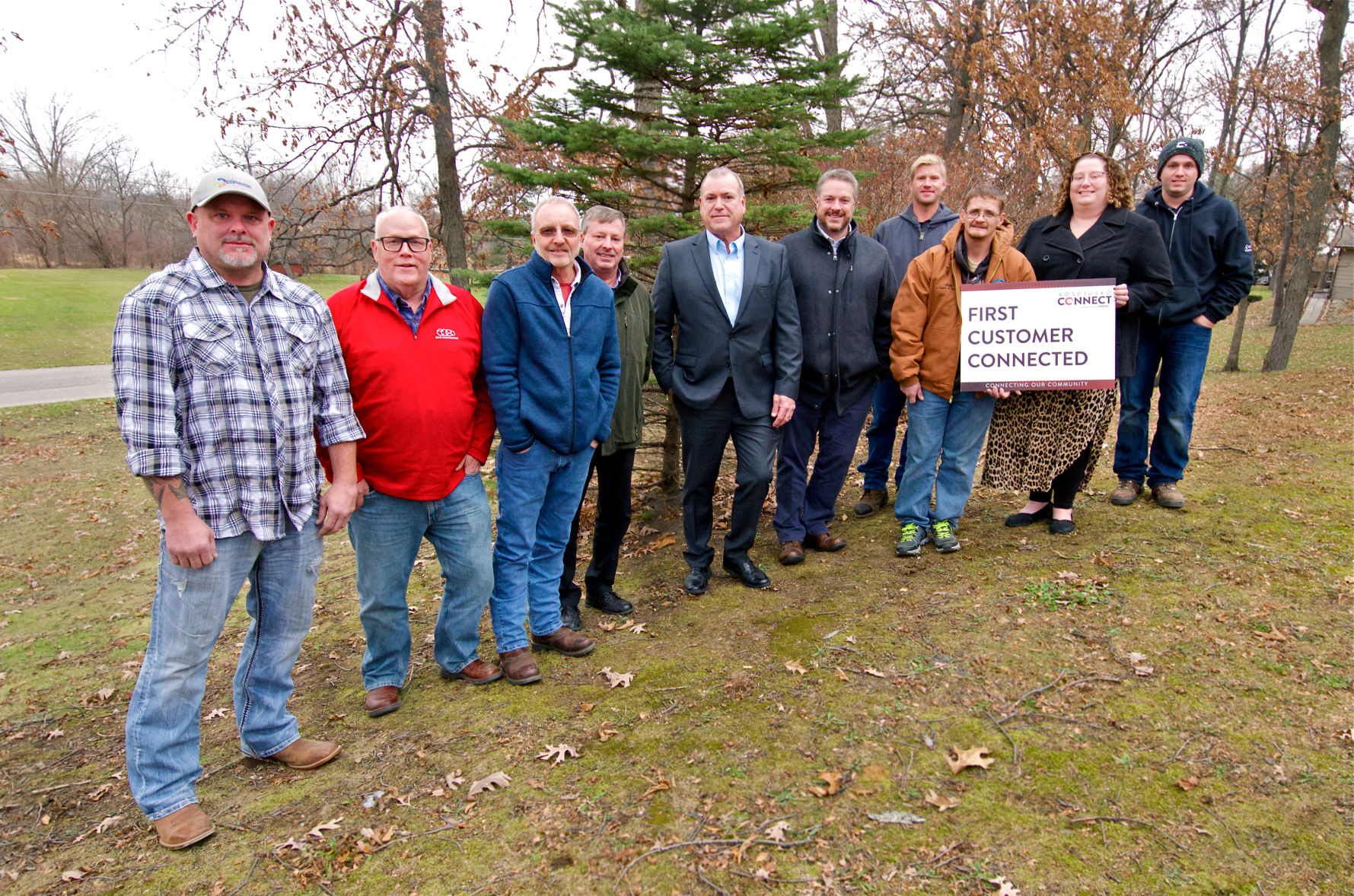 Photo of first customers (a couple) of Kosciusko Connect to be connected to the fiber network, alongside several Kosciusko Connect employees